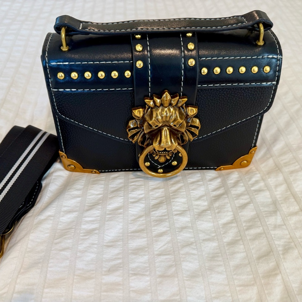 Chic Black Crossbody Bag with Gold Lion Accent